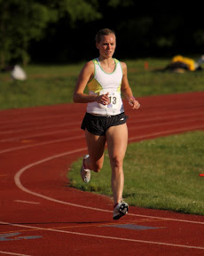 Coach Jenny Cunningham kicking hard in the Women's Open Mile.
