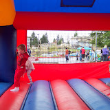 Kids jumping the the bouncy house