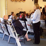 Yvonne chatting with Jodi and Jay before the worship service