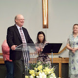 Pastor John greeting the congregation