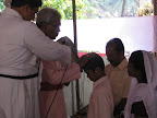 Bishop Dr.C.V.Mathew praying for the child of Br.Moses(Kumbanad).