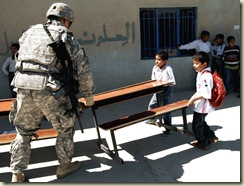 Sodier helps fix a school in Iraq.
