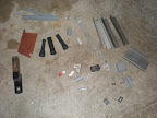 Misc brackets, plastic and metal, bally midway nameplate, pinball rubbers, hitch.