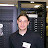 Andy in front of a computer rack (2).JPG