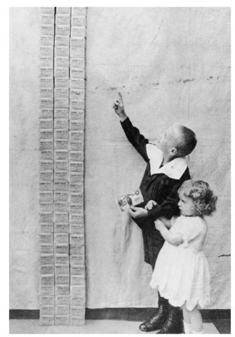 Standardization is crucial to maintaining stability in a society. During the German inflationary crisis of the 1920s, hyperinflation led to an economic depression and the rise of adolf Hitler. Here, two children gaze up at a stack of 100,000 German marks—the equivalent at the time to one u.s. dollar.