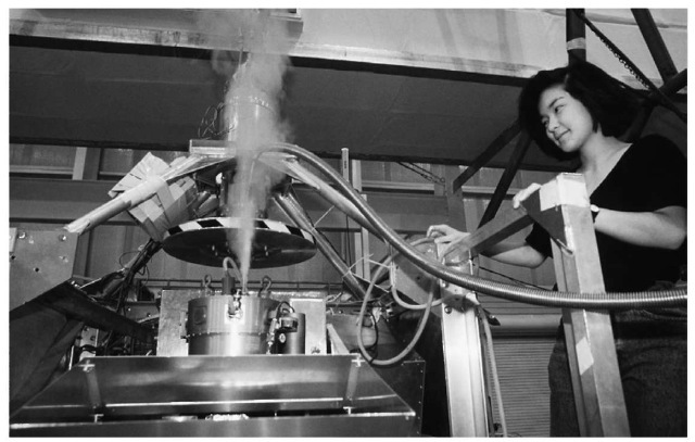 A researcher works with liquid helium as part of an experiment on cosmic background radiation. Close to absolute zero, helium transforms into a highly unusual liquid that has no measurable resistance to flow.