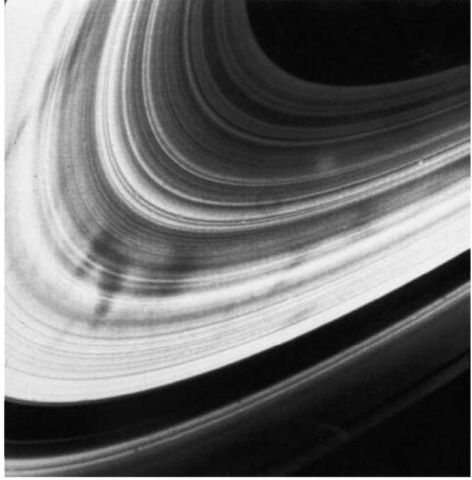 Close-up Voyager 2 picture of Saturn's rings showing its structure as a multitude of ringlets and the mysterious dark radial features or 'spokes' (NASA picture). This figure is available in full color at http://www.mrw.interscience.wiley.com/esst.