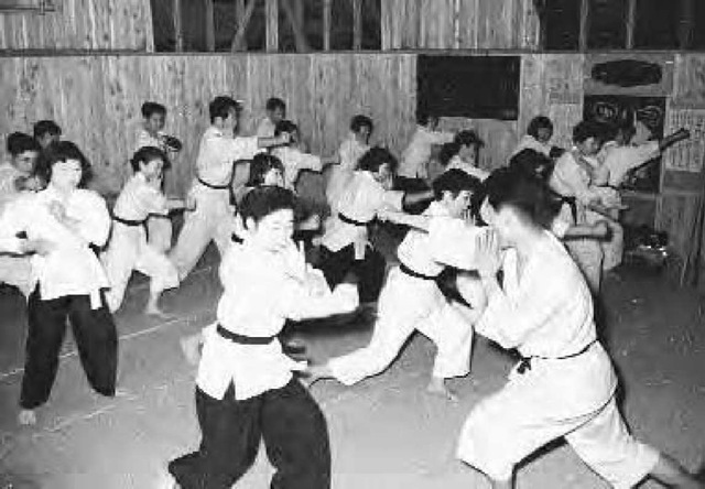 Japanese men and women practicing Kenpo, ca. 1955.