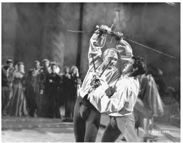 English actor, producer, and director Laurence Olivier plays Hamlet in his 1948 film production of Shakespeare's work. He is involved in the fatal duel with Laertes, played by Terence Morgan. 