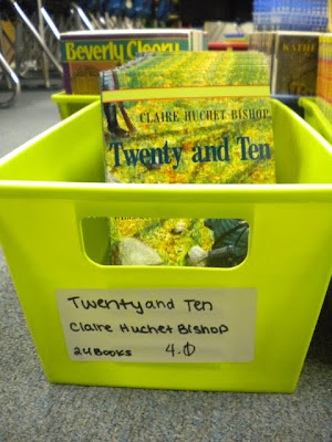 Each basket has a label with the book title, authors name, number of books and reading level