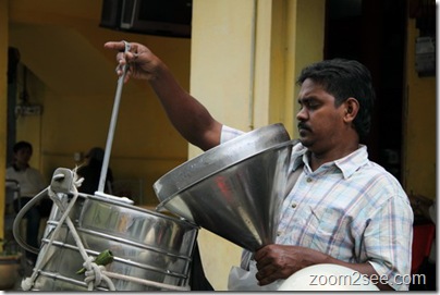 Indian milkman provides home milk delivery services around George Town, Penang 