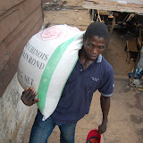  &ndash; Rice being delivered to neighbors near St. Laurence House in Freetown for Christmas. .......© 2007 NHA photos