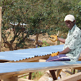  &ndash; James helping to place the zinc sheets on the roof of the school. February 12, 2008. ....© 2008 NHA photos
