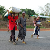  &ndash; Carrying the rice and supplies to the house, March 2008.....© 2008 NHA photos