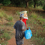  &ndash; carrying the supplies the house, Robarrie Village March 2008.....© 2008 NHA photos