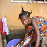  &ndash; Ann Marie washing the family clothes (James Mansaray, photographer) 2007