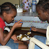  &ndash; Sharing a bowl of cassava soup (James Mansaray, photographer)