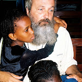  &ndash; Fr. Seraphim sadly saying good-bye to Ann Marie and Lucy as we wait at the heliaport. (James B. Mansaray, photographer)