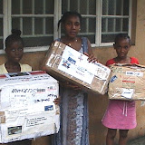  &ndash; Receiving boxes of humanitarian aid for distribution from St. Laurence House in Freetown, Sierra Leone. (James B. Mansaray, photographer) 2006