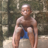  &ndash; This little boy with no shoes and clothes is 11 years old and only in second grade. St. Laurence House tries to keep him provided in flip flops, etc. (©NHA photo James Mansaray 7 June 2007)