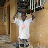  &ndash; This little boy, Osman Kamara helps his sister support the family by selling charcoal. His nickname is: Charcoal BoBo. (©NHA photo James Mansaray 7 June 2007)