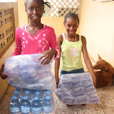  &ndash; Ann Marie and Lucy with water supplies. June 2007 (James Mansaray, photographer)