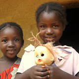  &ndash; Two young girls happy with their toy doll head. Freetown, Sierra Leone ©2007 NHA JMansaray photographer