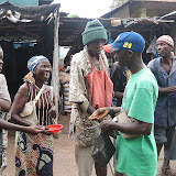  &ndash; James giving alms to those in need. Sierra Leone (27 July 2007)... © 2007NHA photographs/JBM