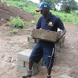  &ndash; James carrying bricks. . ... © 2007 NHA photos, J Mansaray