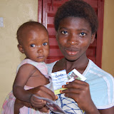  &ndash; Adoma and friend with holy cards given by Kim Zimlich.......© 2007 NHA photos