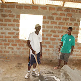  &ndash; James and worker mixing concrete for the school…. © 2008 NHA Media Photos