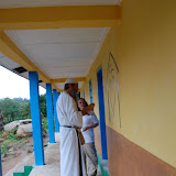  &ndash; Fr. Seraphim paints NHA Logo/Trade Mark on the Kabala School Building...© 2008 September Nazareth House Apostolate Media, James B. Mansaray, photographer.
