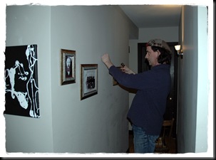 Mill St set up John R hanging ancestor photos in hall DSC_0049