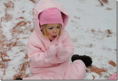 Abigail eating snow