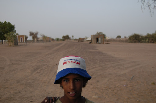 Kid in Sani, the village where the bike broke down and I spent the night.