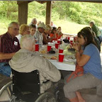 Jim Dunkley enjoys picnic and conversation with his young kin folks.