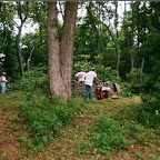 Click to Expand Left Virginia Melton waits to pick up brush. 2nd from left George cleans out the grave sites of Michael Gleaves. Right : Owen Gleaves mows with a small tractor.