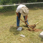 Owen digs out hole to place marker.