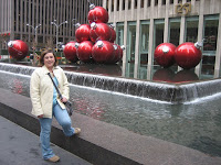 Erika with the giant christmas balls outside of Radio City Music Hall