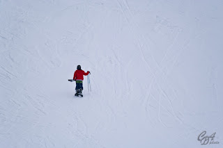 Lonely skier climbing on foot
