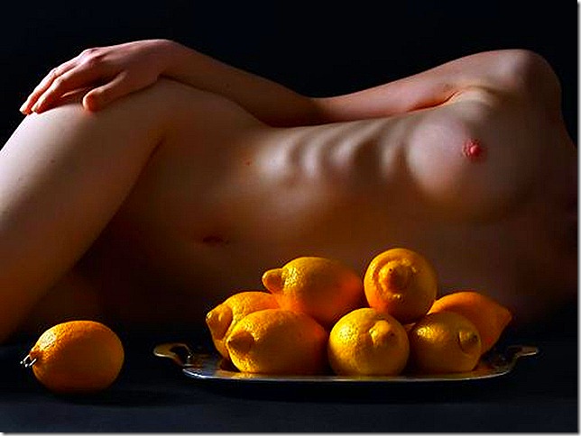 nude woman with lemons