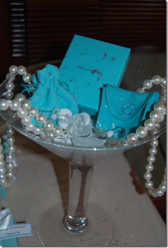 At each table we chose to display pearl teal necklaces as the