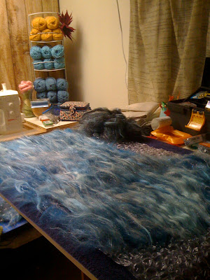 Laying out the second layer of batting -- sparkly!