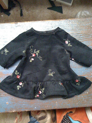 Doll dress made from black corduroy with pink flowers