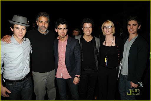 LOS ANGELES, CA - JANUARY 22: In this handout photo provided by MTV, (L-R) Nick Jonas, George Clooney, Joe Jonas, Kevin Jonas, Ellen Barkin and Zac Efron at the Hope For Haiti Now: A Global Benefit For Earthquake Relief telethon on January 22, 2010 in Los Angeles, California. (Photo by Jeff Kravitz/MTV Hope for Haiti Now via Getty Images)