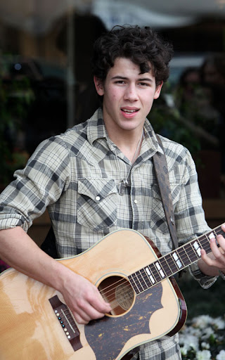 02-02-10 Sherman Oaks, CA  Nick Jonas performed a solo show for his fans outside of Mark's Garden flower shop in Sherman Oaks. After the show, he handed out roses to all the girls in attendance. Like a typical teenager, Nick has a few zits on his face.  NON-EXCLUSIVE PIX by Flynet ©2010 818-307-4813  Nicolas