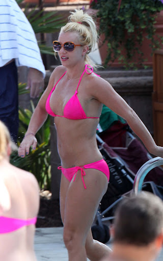 Britney Spears enjoying the sunshine at The Ritz Carlton in a bright pink bikini. <P> Pictured: Britney Spears <B>Ref: SPL119357 150809 </B><BR/> Picture by: Clint Brewer / Splash News<BR/> </P><P> <B>Splash News and Pictures</B><BR/> Los Angeles: 310-821-2666<BR/> New York: 212-619-2666<BR/> London: 870-934-2666<BR/> photodesk@splashnews.com<BR/> </P>