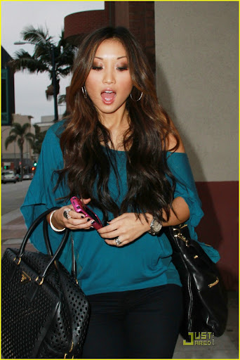 42348, BEVERLY HILLS, CALIFORNIA - Wednesday July 7, 2010. Disney actress Brenda Song has her hands full as she leaves Longmi Lashes Salon in Beverly Hills after getting her eyelashes done. The 22 year old "Suite Life of Zack and Cody" star is seen holding a Prada duffel bag, another leather handbag, and her phone as she heads back to her car. Photograph: Greg Tidwell, PacificCoastNews.com**FEE MUST BE AGREED PRIOR TO USAGE** **E-TABLET/IPAD & MOBILE PHONE APP PUBLISHING REQUIRES ADDITIONAL FEES** UK OFFICE:+44 131 557 7760/7761 US OFFICE:1 310 261 9676