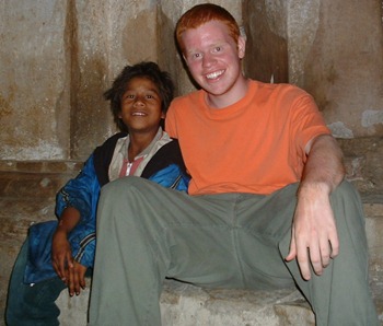 Micah with a homeless child Micah with a homeless child