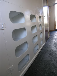 Hidey holes for shoes and kit in the changing room.
